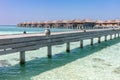 Resort in Maldives. Water villas along wooden jetty Royalty Free Stock Photo