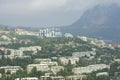 Resort town Gurzuf, buildings beach sea mountain plunged in a fog. Southern coast of the Black Sea, Crimea.