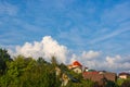 Resort village in mountain valley against the blue sky with clouds, summer landscape Royalty Free Stock Photo