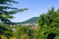 Resort village in mountain valley against the blue sky with clouds, summer landscape Royalty Free Stock Photo