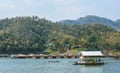 Resort wooden home raft floating and mountain fog on river