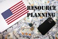 Resource planning concept. USA flag, dollar money with keys, laptop and phone background Royalty Free Stock Photo