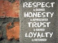 Respect is earned honesty is appreciated trust is gained loyalty is returned written on concrete. Inspirational quote concept. Royalty Free Stock Photo