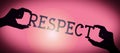 Respect - human hands holding black silhouette word Royalty Free Stock Photo