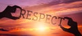 Respect - human hands holding black silhouette word Royalty Free Stock Photo