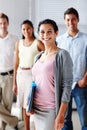 Respected and well-liked architectural manager. Portrait of a beautiful young businesswoman smiling at you with her team Royalty Free Stock Photo