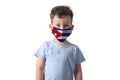 Respirator with flag of Cuba White boy puts on medical face mask isolated on white background
