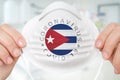 Respirator mask with flag of Cuba - Coronavirus COVID-19 concept
