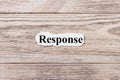 RESPONSE of the word on paper. concept. Words of RESPONSE on a wooden background Royalty Free Stock Photo