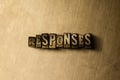 RESPONSES - close-up of grungy vintage typeset word on metal backdrop Royalty Free Stock Photo