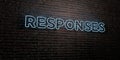 RESPONSES -Realistic Neon Sign on Brick Wall background - 3D rendered royalty free stock image Royalty Free Stock Photo