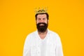 Responsibility being king. Handsome bearded guy king on yellow background. King crown. Egoist selfish man. Bearded man