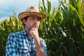 Responsible corn farmer in field thinking