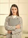 Responsible trainee. Cute shy woman in jacket. Office worker. Formal fashion. Woman hold office folder. Girl Royalty Free Stock Photo