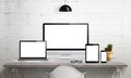 Responsive devices on desk with isolated screen for mockup.