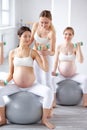 responsive caucasian fitness couch teaching training pregnant women