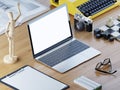 Responsive mockup screen laptop on a wooden table with decoration.