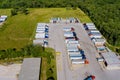 Rest area of truck stop of trucks trailers parked a row near US Interstate road Royalty Free Stock Photo