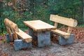 Park bench with table made of natural wood Royalty Free Stock Photo