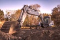 Rest, big excavator with shovel at construction site. Royalty Free Stock Photo