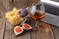 Rest in the evening after work a glass of cognac with fruit near