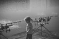 Rest on a fishing trip. Little boy with fishing rods on pier Royalty Free Stock Photo