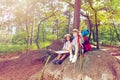 Rest during hiking boy and girl sit on the stone Royalty Free Stock Photo