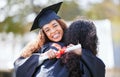 The rest of our lives will be the best of our lives. Portrait of a young woman hugging her friend on graduation day. Royalty Free Stock Photo