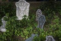 Rest in Peace RIP Gravestone Halloween Decoration with Skulls over green leaves in Halloween concept Royalty Free Stock Photo