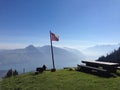 Rest place in the mountains with the swiss flag Royalty Free Stock Photo