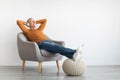 Calm mature man having rest at home listening to music Royalty Free Stock Photo