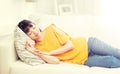 Happy asian teenage girl sleeping on sofa at home Royalty Free Stock Photo