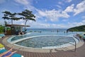 Rest & relax beside round swimming pool with bar overlooking the sea, ocean on a resort in Boracay Island, Philippines