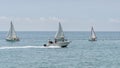 Rest on sea. Motor boat, boats with sail. Outdoor sea sporting activity