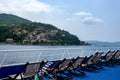 People rest lying in armchairs on the ship`s deck Royalty Free Stock Photo