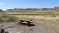 A rest stop along the BoundaryCrossing Highway with picnic tables and a map showing the various routes that intersect at