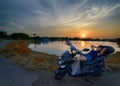 Rest at sunset with motorcycle and woman