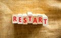 Restart and start symbol. The concept word Restart on wooden blocks. Beautiful canvas background, copy space. Business restart and Royalty Free Stock Photo