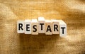 Restart and start symbol. The concept word Restart on wooden blocks. Beautiful canvas background, copy space. Business restart and Royalty Free Stock Photo