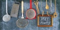 Restaurant announcing food delivery during corona virus lockdown, kitchen utensils and message on black board,take away food