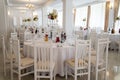 Restaurant banquet hall with served decorated wedding tables