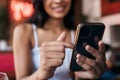 Restaurant, bar and smartphone in hands of woman for social networking, mobile chat app and internet scroll, surfing or