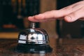 Restaurant bell vintage with hand. Hotel service bell Royalty Free Stock Photo
