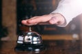 Restaurant bell vintage with hand. Hotel service bell Royalty Free Stock Photo