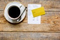 Restaurant bill, card and coffee on wooden table background top view space for text Royalty Free Stock Photo