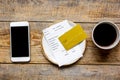 Restaurant bill paying by credit card and phone on wooden table background top view mock-up Royalty Free Stock Photo