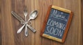 Restaurant blackboard announcing reopening after the corona lockdown,cooking, food business shutdown,coming soon