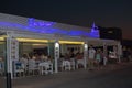 Restaurant with blue neon sign Royalty Free Stock Photo