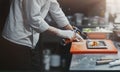 Restaurant Chef cook preparing salmon filet flambe in open kitchen Royalty Free Stock Photo