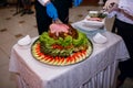 The restaurant chef cuts the already cooked meat and serves it to the waiter Royalty Free Stock Photo